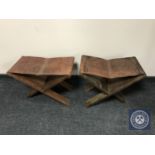 A pair of African style leather topped stools