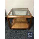 A teak G-plan glass topped coffee table