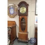 An early 20th century mahogany regulator clock, height 200 cm, with pendulum and two weights.