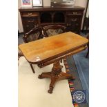A 19th century mahogany tea table on pedestal base,