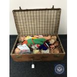 A vintage leather case containing mid twentieth century dolls