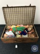 A vintage leather case containing mid twentieth century dolls