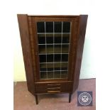 A mid 20th century leaded door corner cabinet