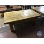 A pine farmhouse coffee table fitted with a drawer