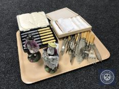 A tray of cased and loose cutlery,