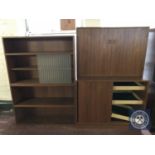 A mid twentieth century teak double door storage cabinet together with a sliding door bookshelf