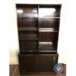 A mahogany open bookcase fitted with double cupboard beneath