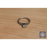 An 18ct white gold solitaire diamond ring