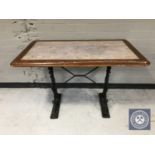 Two rectangular bar tables on cast iron bases