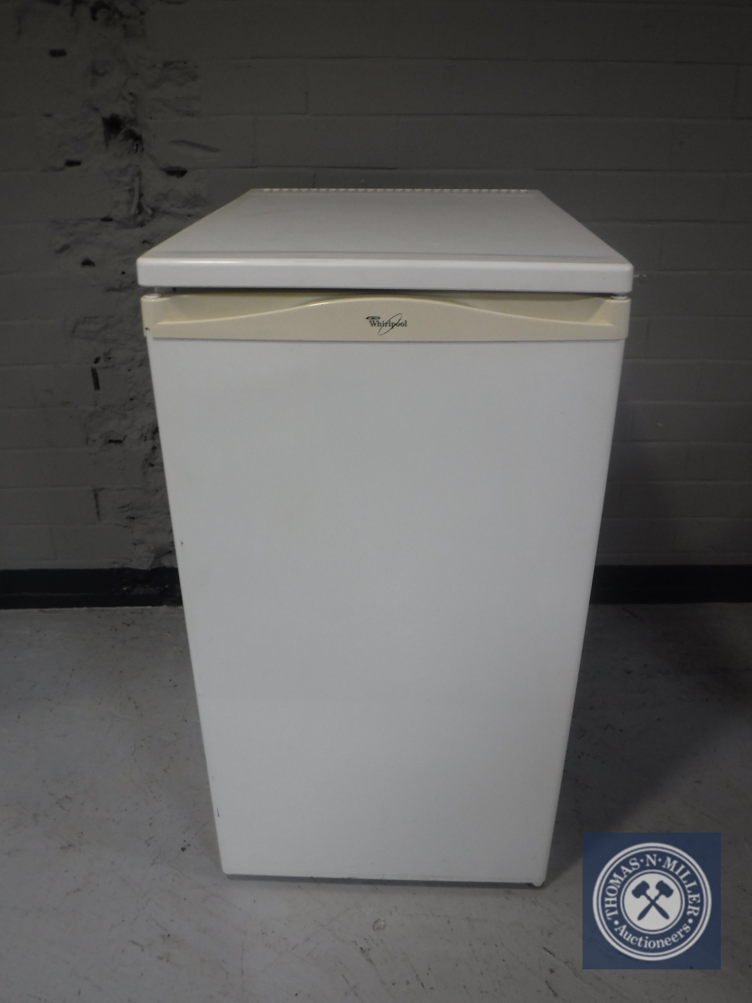 A Whirlpool under bench fridge