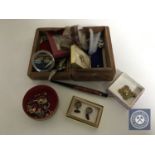 A carved Eastern box of costume jewellery, cuff links, tie pins, nail care kit, fountain pen,