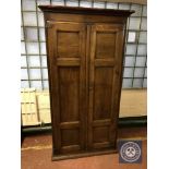 A 19th century oak double door hall cabinet