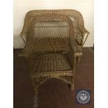 A wicker two seater settee and armchair