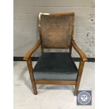 A 20th century bergere backed bedroom chair