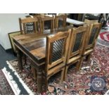 An Eastern style hardwood dining table with six chairs