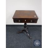 An early 19th century mahogany pedestal occasional sewing table fitted with a drawer