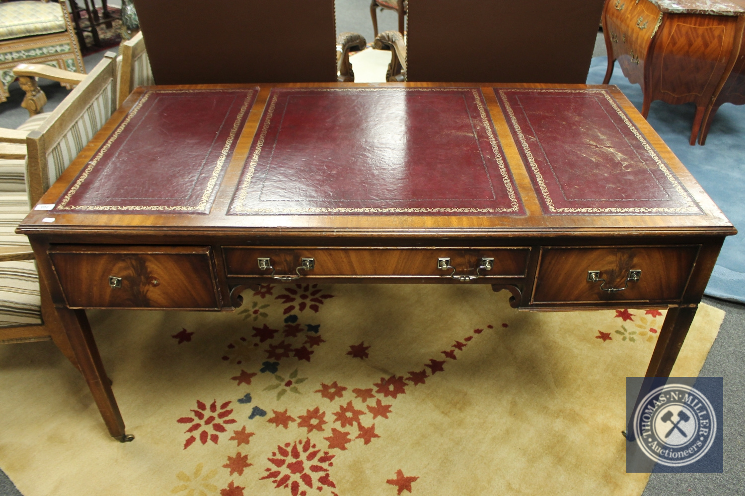 *** Withdrawn *** An Edwardian mahogany desk fitted with three drawers and tooled leather top,