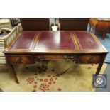 *** Withdrawn *** An Edwardian mahogany desk fitted with three drawers and tooled leather top,