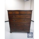 A late George III mahogany six drawer chest on bracket feet