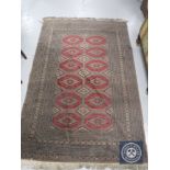 A Persian style fringed rug