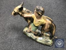 A large Art Deco chalk figure of a boy and an Alsatian