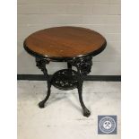 A circular Britannia pub table on cast iron base