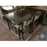 A late 20th century kitchen table and four chairs
