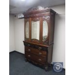 An Edwardian mirror door press fitted with five drawers