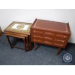 A nest of three Danish teak tiled tables together with a hand painted three drawer bedside chest