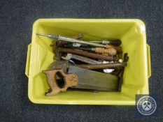 A box containing vintage hand tools