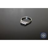 A platinum three stone diamond ring,