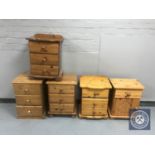 Four pine three drawer bedside chests together with a bedside cupboard fitted with a drawer