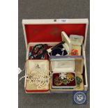 A jewellery box containing costume jewellery,