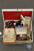 A jewellery box containing costume jewellery,