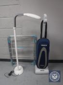 An Oreck upright vacuum,