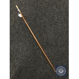 A swagger stick with 18ct gold plated and enamel mount