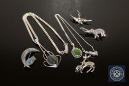 A collection of silver jewellery to include two pendants and four brooches
