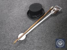A shooting stick together with a silver handled walking cane and a gent's hat