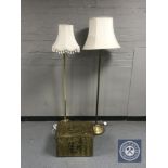 Two brass standard lamps with shades and a brass embossed coal receiver