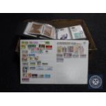 A box containing a large quantity of stamps,
