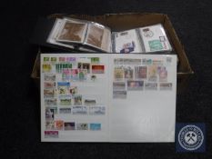 A box containing a large quantity of stamps,