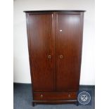 A Stag Minstrel double wardrobe fitted a drawer