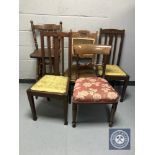 A pair of oak rail back chairs together with two antique mahogany chairs and an oak bar stool