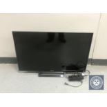 A Sony Bravia KDL-32 R413B LCD TV with remote and lead