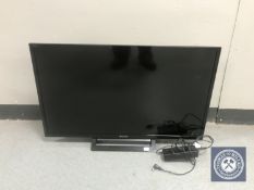 A Sony Bravia KDL-32 R413B LCD TV with remote and lead