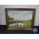 A gilt framed oil on canvas of a gun dog,