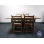 A 20th century oak refectory dining table together with four chairs