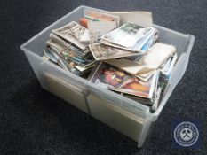 A box of a large quantity of 20th century monochrome and colour postcards