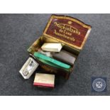 A vintage Mackintosh's Deluxe Assortment's biscuit tin containing recorder, Hohner Melodica Soprano,