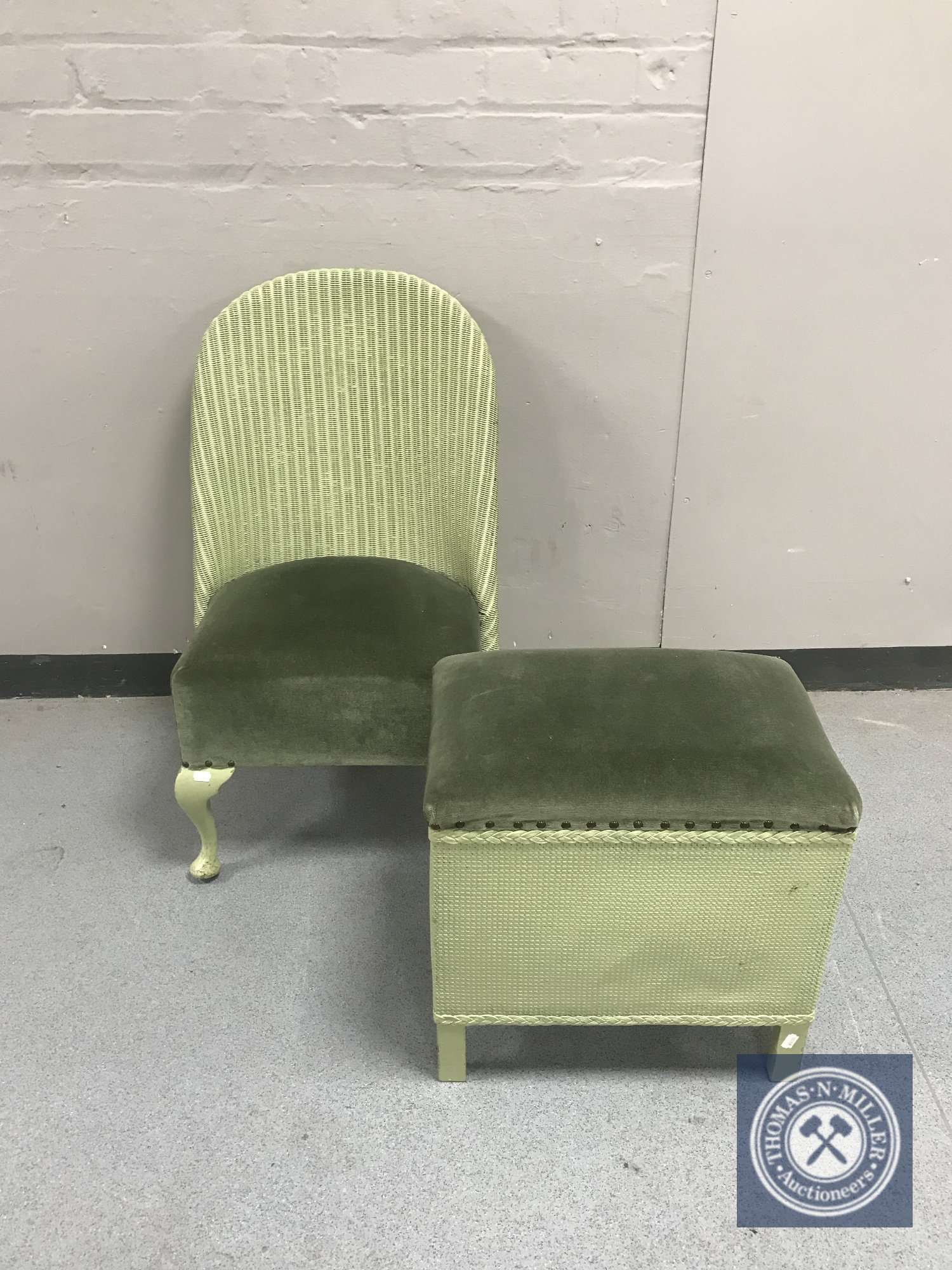 A green loom bedroom chair together with a storage footstool